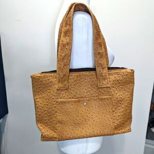 Beautiful vintage hand made bag with wood bottom finish